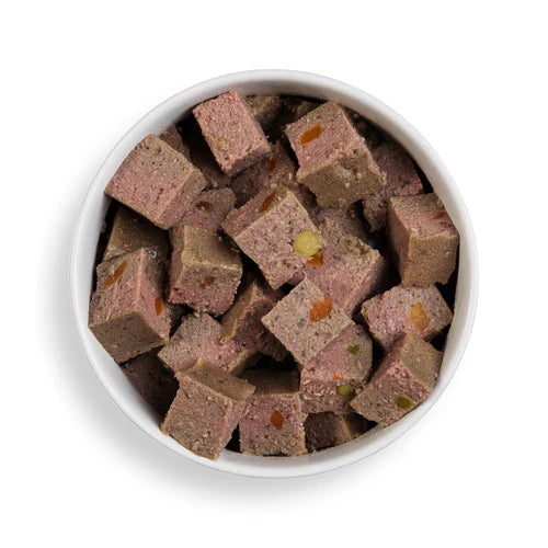 Close-up of Forthglade chicken wet dog food served in a bowl, showcasing the wholesome, grain-free recipe with visible vegetables.