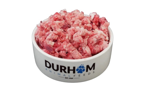 A bowl of DURHAM brand animal feed, predominantly consisting of minced beef.