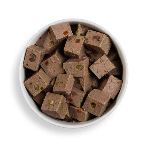 Close-up of Forthglade Beef Wet Dog Food showing meaty chunks and vegetables, gently steamed for taste and nutrition.