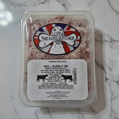 Packaged dog food with 'The Dog's Butcher' label on a white background