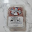 Packaged dog food with 'The Dog Butcher' label on a white surface