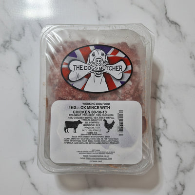 Packaged dog food with 'The Dog Butcher' label on a white surface