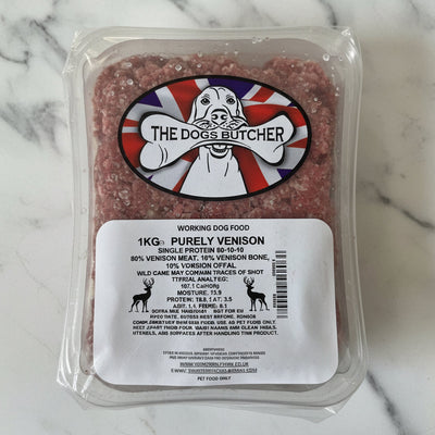 Packaged meat product with 'The Dog's Butcher' label on a white surface
