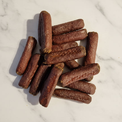 dog treats on a white marble backgorund

