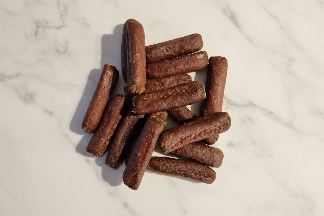 dog treats on a white marble backgorund
