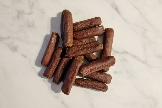 dog treats on a white marble backgorund
