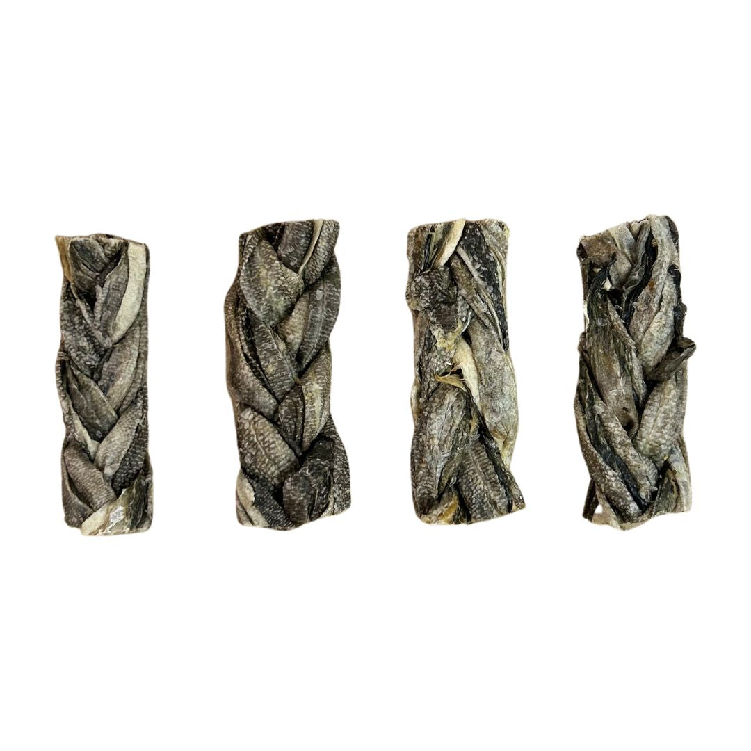 Four braided fish skin sticks on a white background