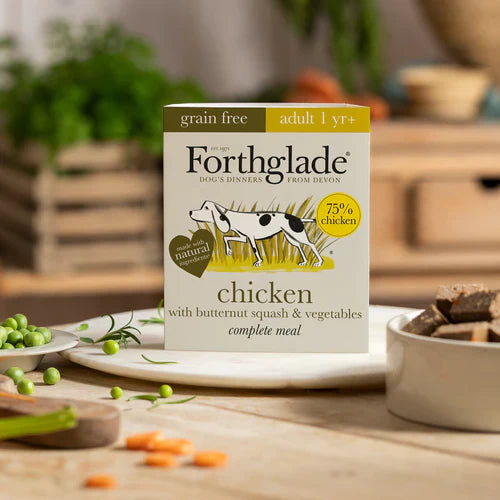 Forthglade Chicken Complete dog food pack photographed in a natural, outdoor setting to highlight its wholesome, nature-inspired qualities.