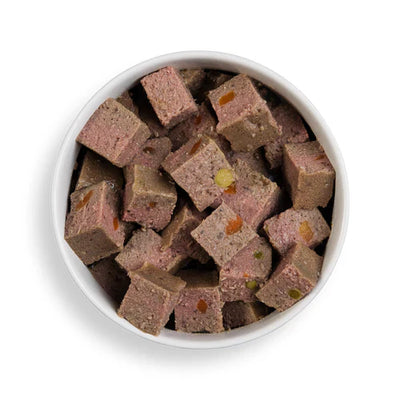 Close-up of Forthglade chicken wet dog food served in a bowl, showcasing the wholesome, grain-free recipe with visible vegetables.