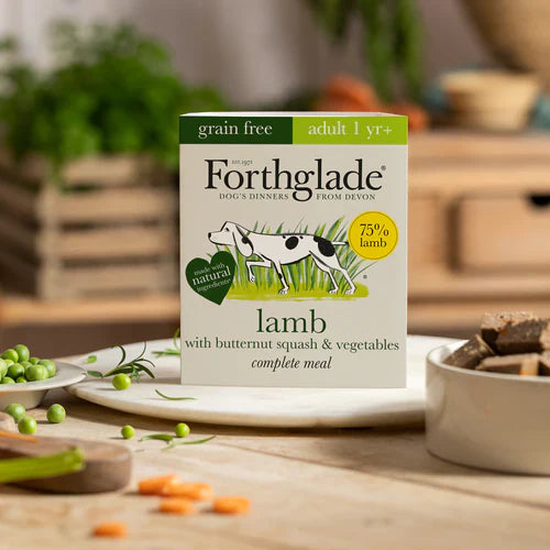 Forthglade Lamb Complete dog food pack placed in a scenic kitchen setting, emphasizing its natural, wholesome qualities.

