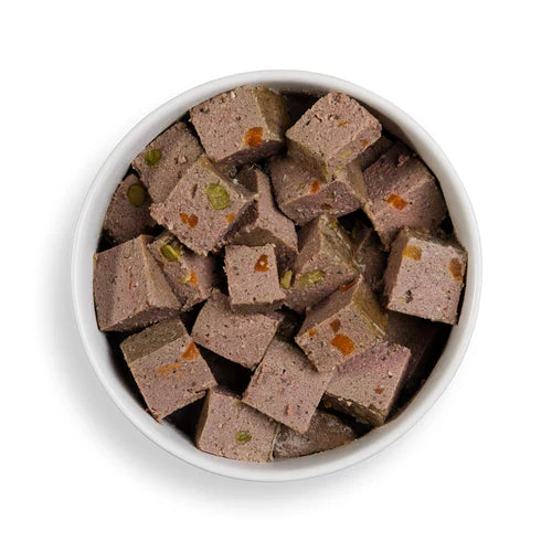 Close-up of Forthglade lamb wet dog food served in a bowl, showcasing the natural, chunky texture and grain-free ingredients.

