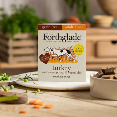 Forthglade Turkey Complete dog food pack displayed in an outdoor scenic setting, representing its natural and healthy values.