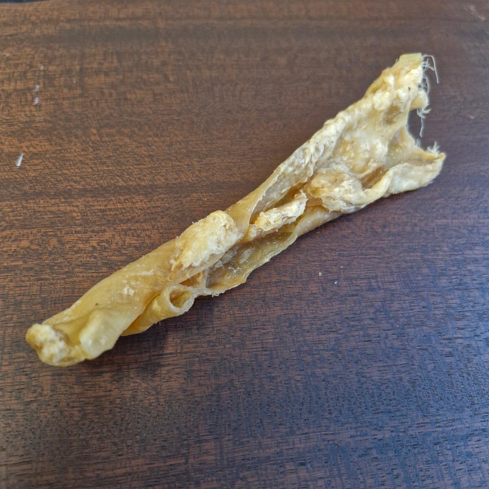 Dog chew treat on a wooden surface