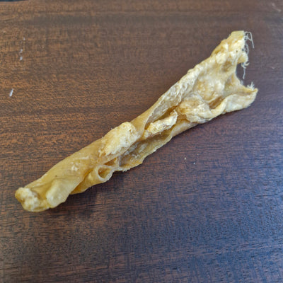 Dog chew treat on a wooden surface