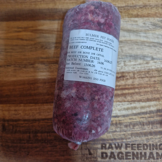 Raw beef product with a label on a wooden surface