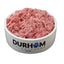 A bowl of DURHAM brand quail mince feed, predominantly pink in color, with the brand name visible on the bowl.