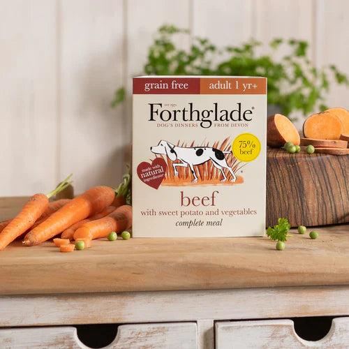 A tray of Forthglade Beef Wet Dog Food in a natural setting, highlighting healthy and natural canine nutrition.