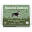 Dog food packaging with 'Natural Instinct' branding and a husky illustration on a green background.