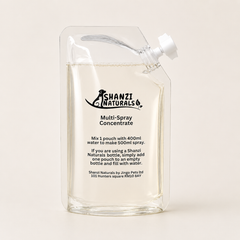 Shanzi Naturals multi-spray concentrate pouch on a beige background