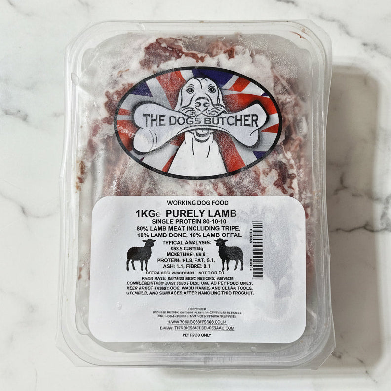 Packaged dog food with 'The Dog's Butcher' label on a white surface